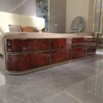 Luxury Bed End Cabinet with Natural Wood Veneer Drawer Fronts Upholstered Top and Stainless Steel Trim